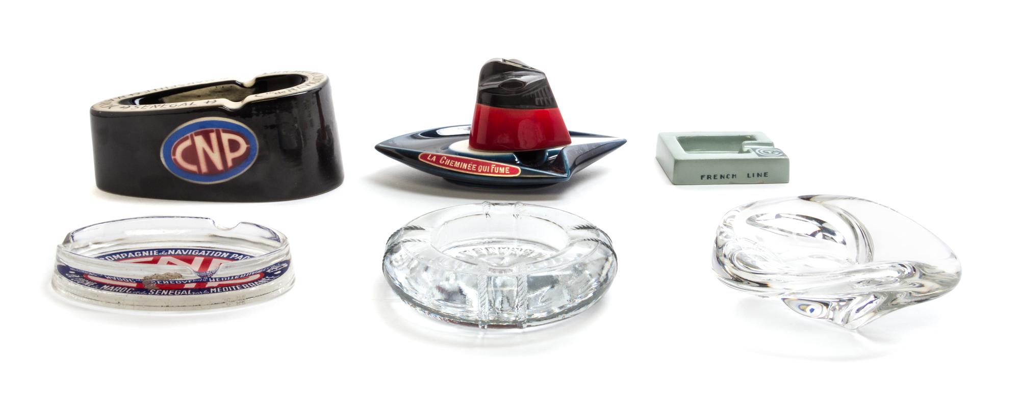 A Collection of Glass and Ceramic Ash Receivers from French Ocean Liners Height of tallest 2 1/4 inches. — 20TH CENTURY