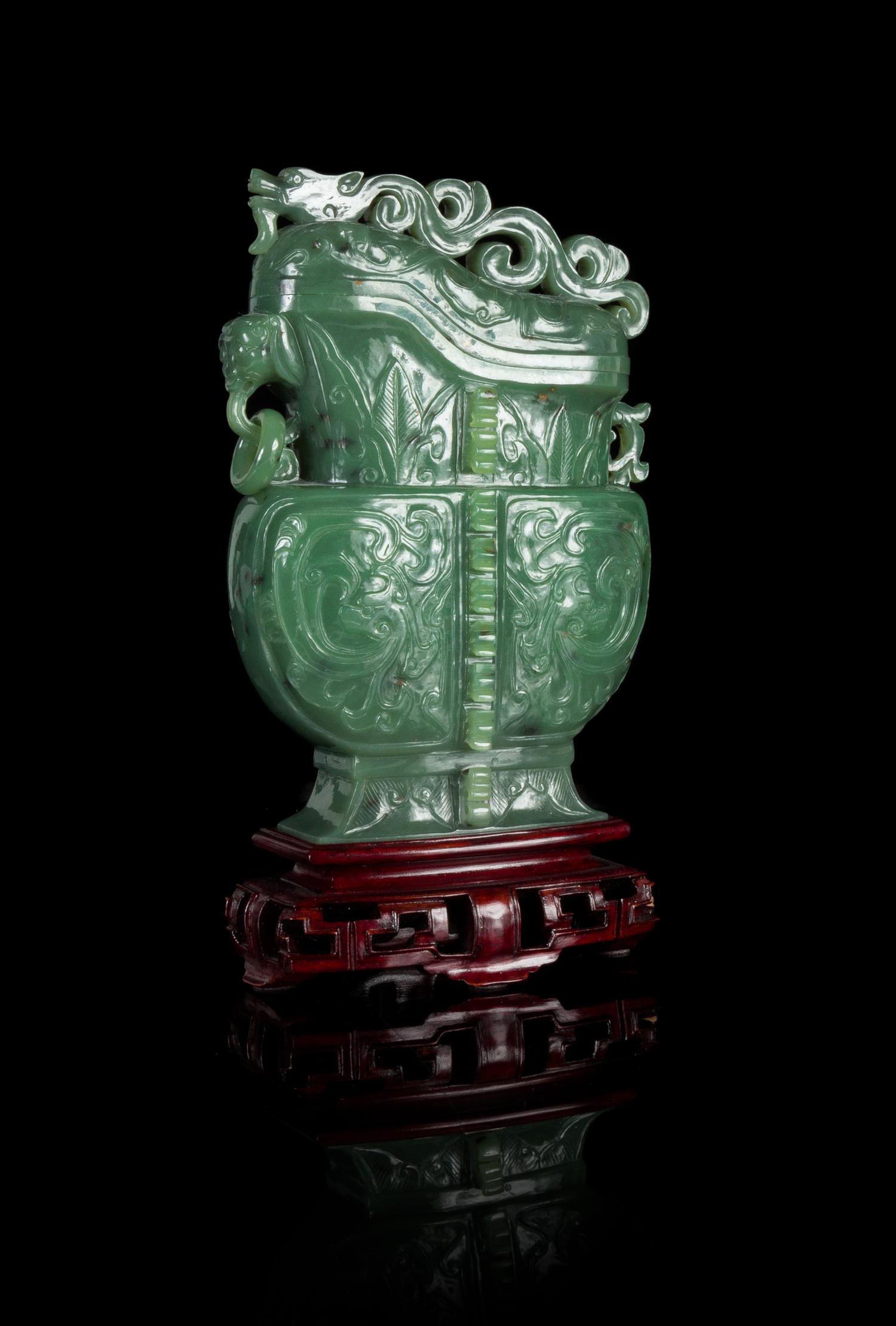 A Carved Spinach Jade Covered Vase Height of the vessel 7 inches. — 20TH CENTURY