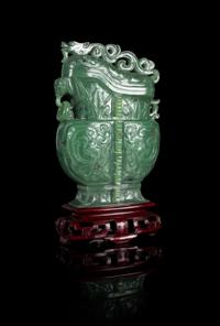 A Carved Spinach Jade Covered Vase Height of the vessel 7 inches. — 20TH CENTURY