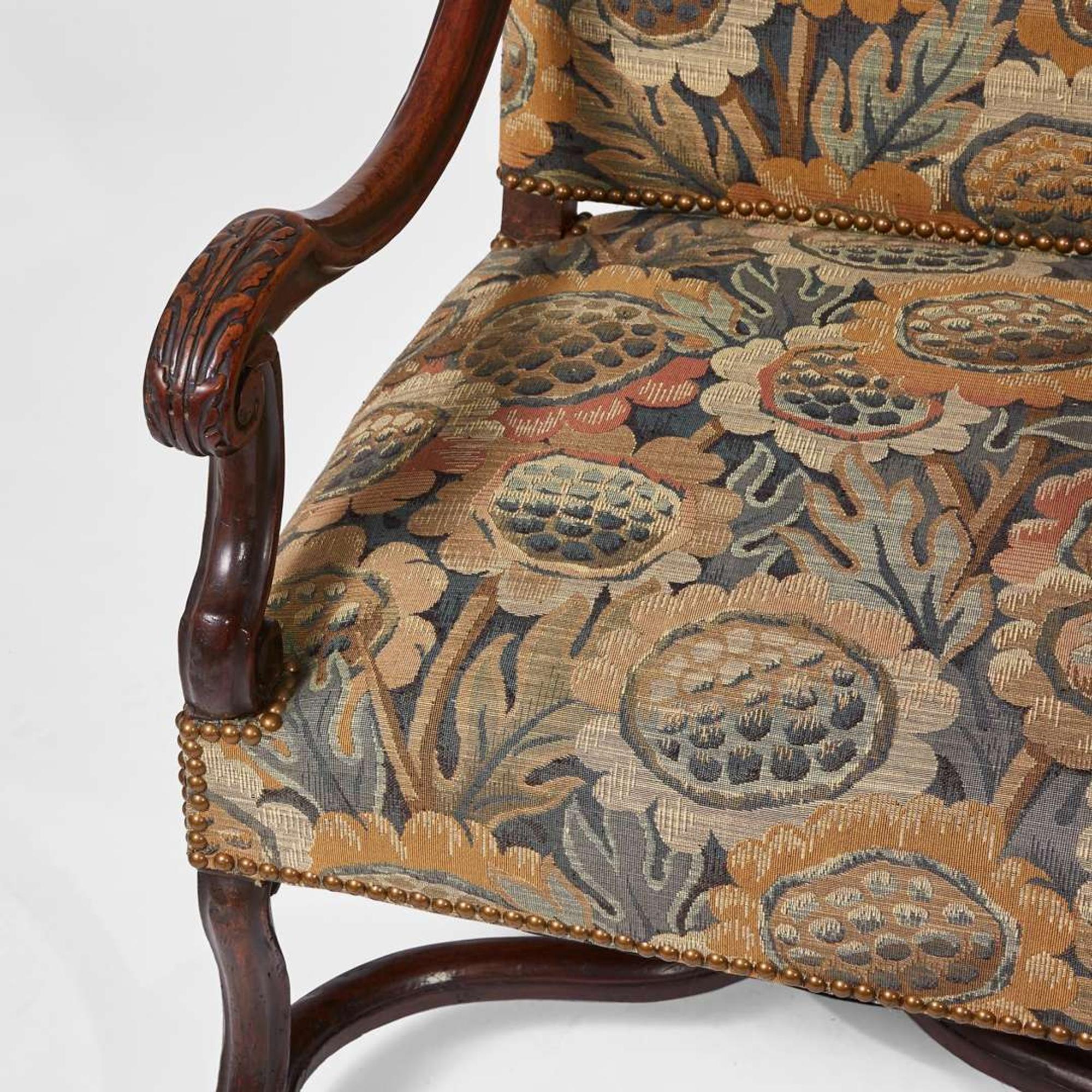 A pair of Baroque Revival carved walnut armchairs late 19th / early 20th century