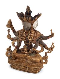 A Tibetan Style Gilt Bronze, Rock Crystal and Cabochon-Inset Figure of a Deity