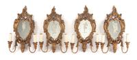 A Set of Four Venetian Giltwood Two-Light Girandole Mirrors Height 24 x width 15 1/2 inches.