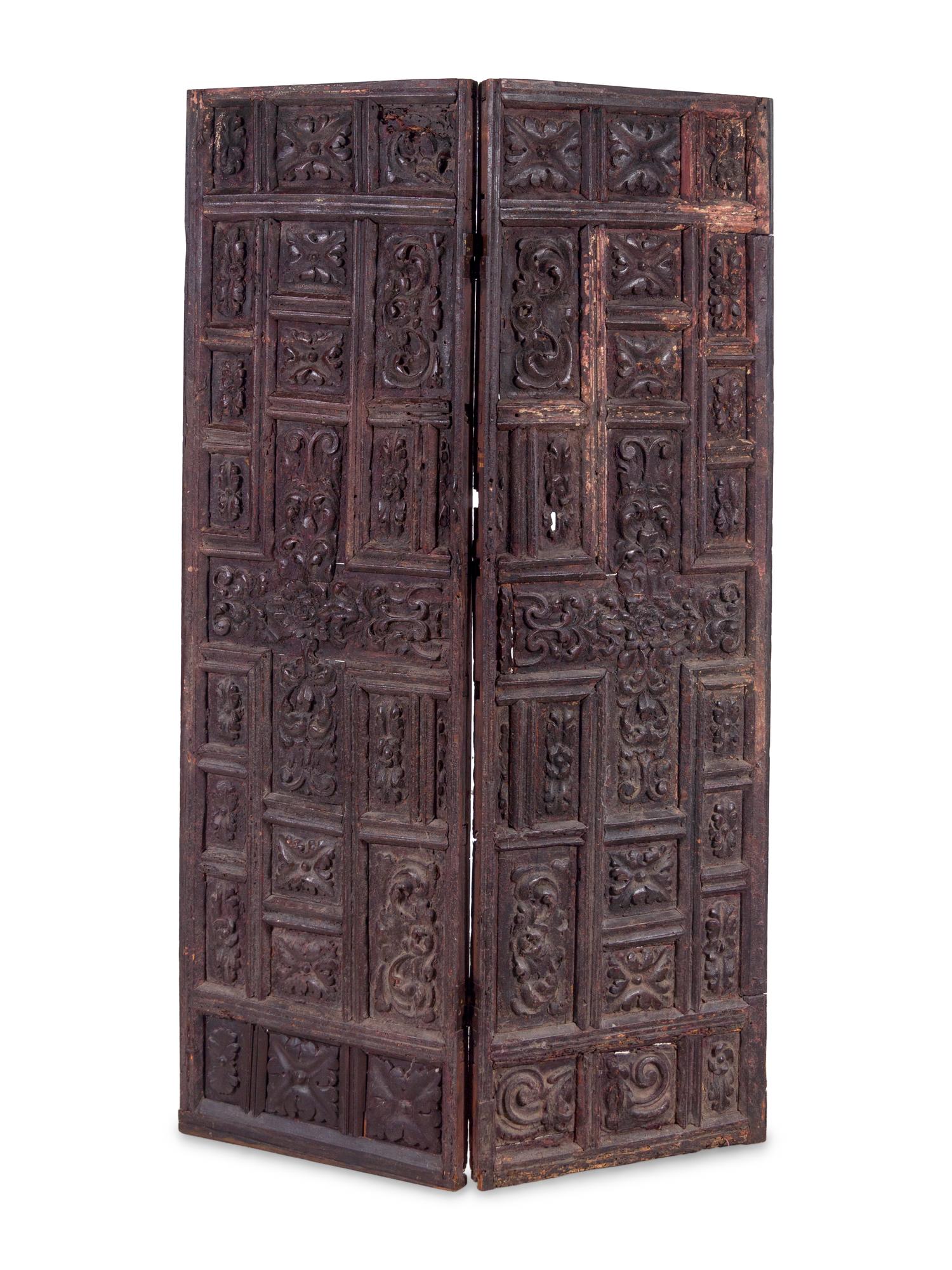 A Pair of Continental Carved Panels or Doors
