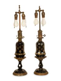 A Pair of Gilt Decorated Black Glass and Gilt Metal Oil Lamps
