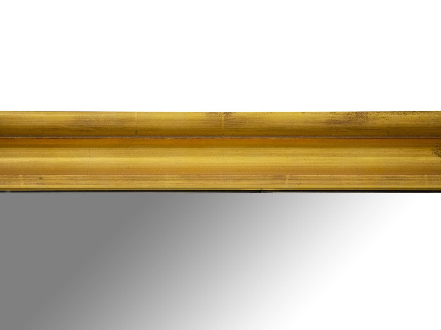 An Oversized Giltwood Mirror