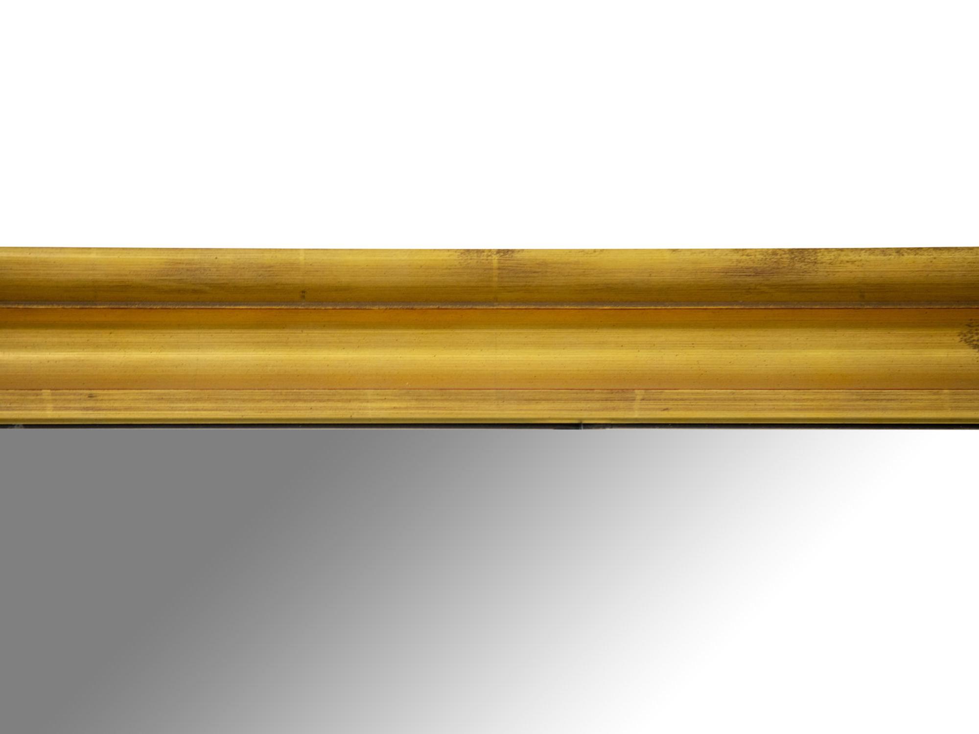 An Oversized Giltwood Mirror