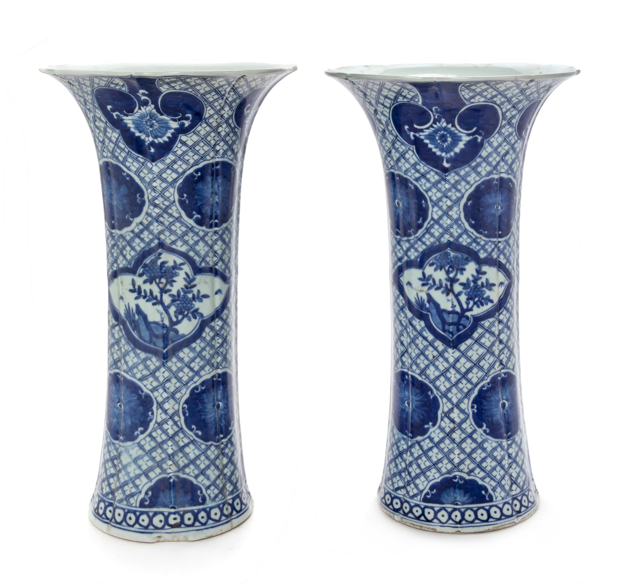 A Pair of Chinese Blue and White Porcelain Gu Vases Height of each 19 inches. — 19TH CENTURY