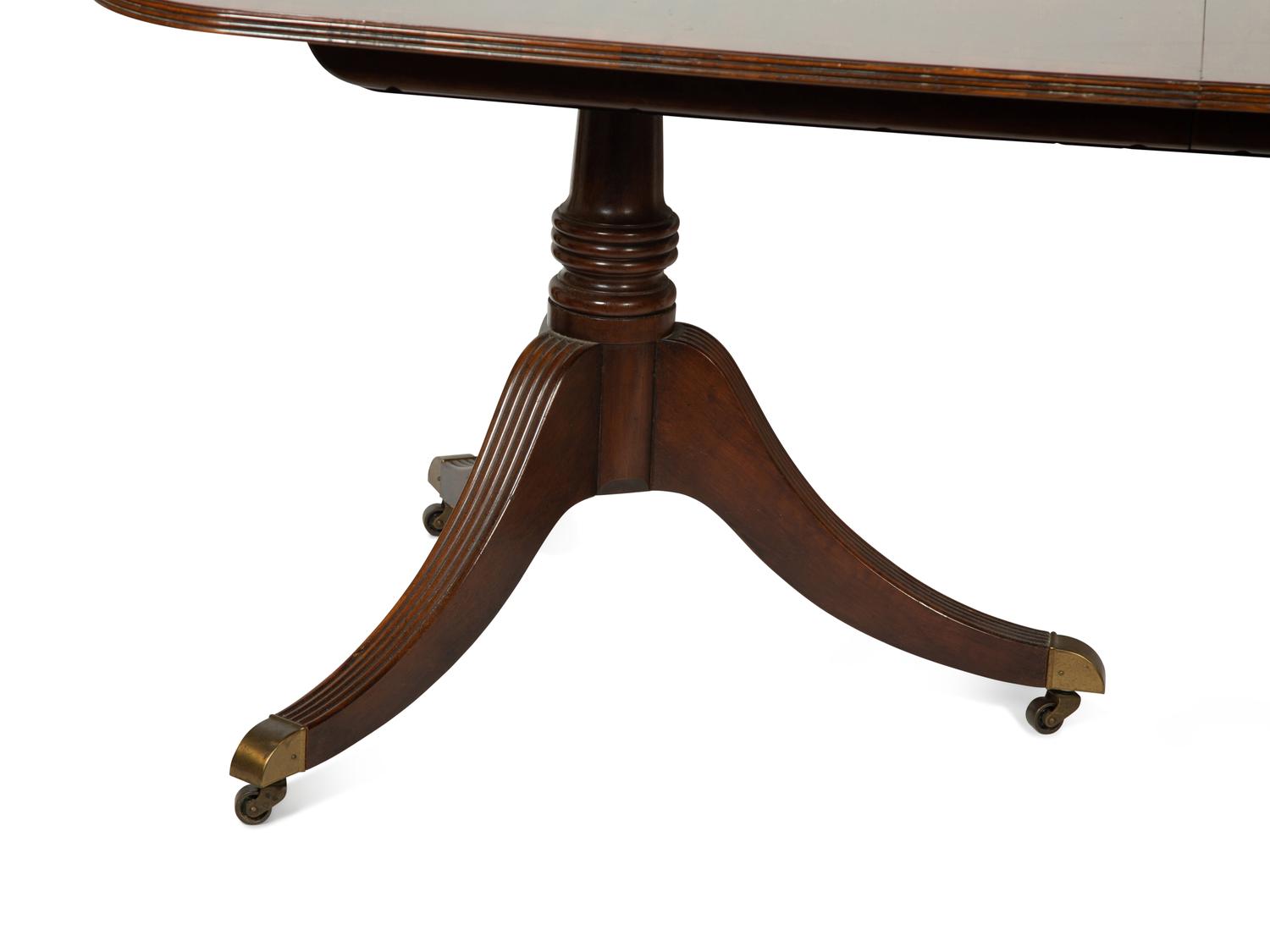 A Baker George III Style Mahogany Double-Pedestal Dining Table