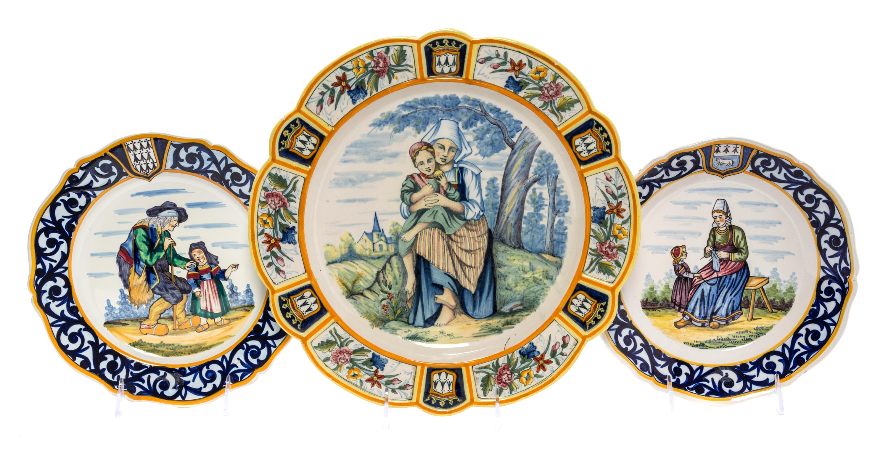 A Group of Three Quimper Pottery Plates Diameter of largest 13 inches.
