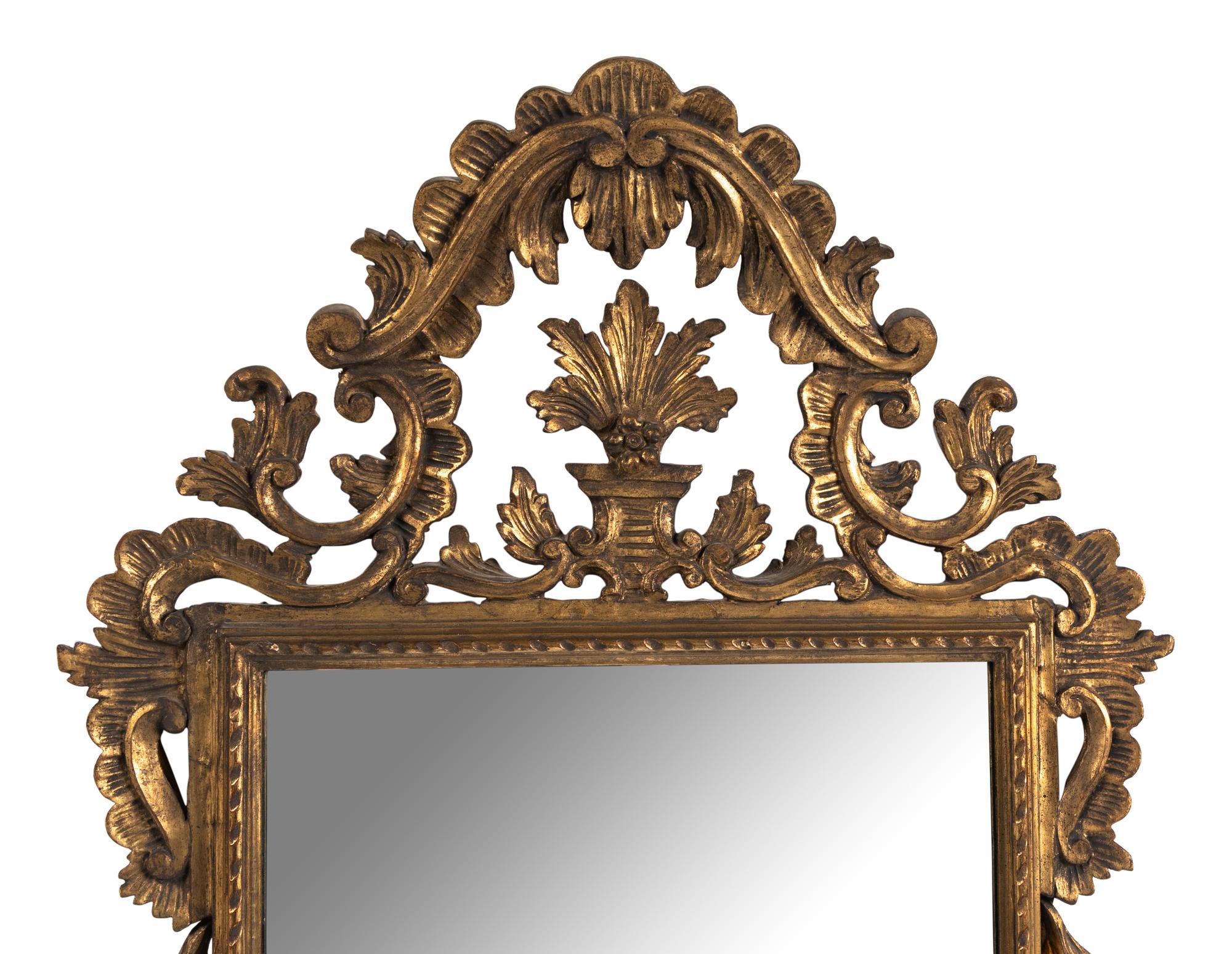 An Italian Baroque Style Giltwood Mirror