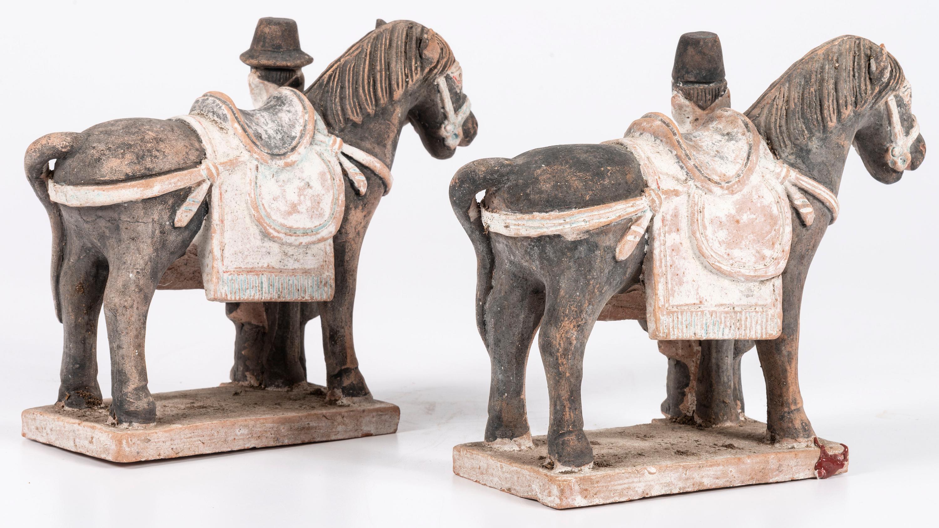 A Pair of Chinese Terracotta Horses with Standing Attendants