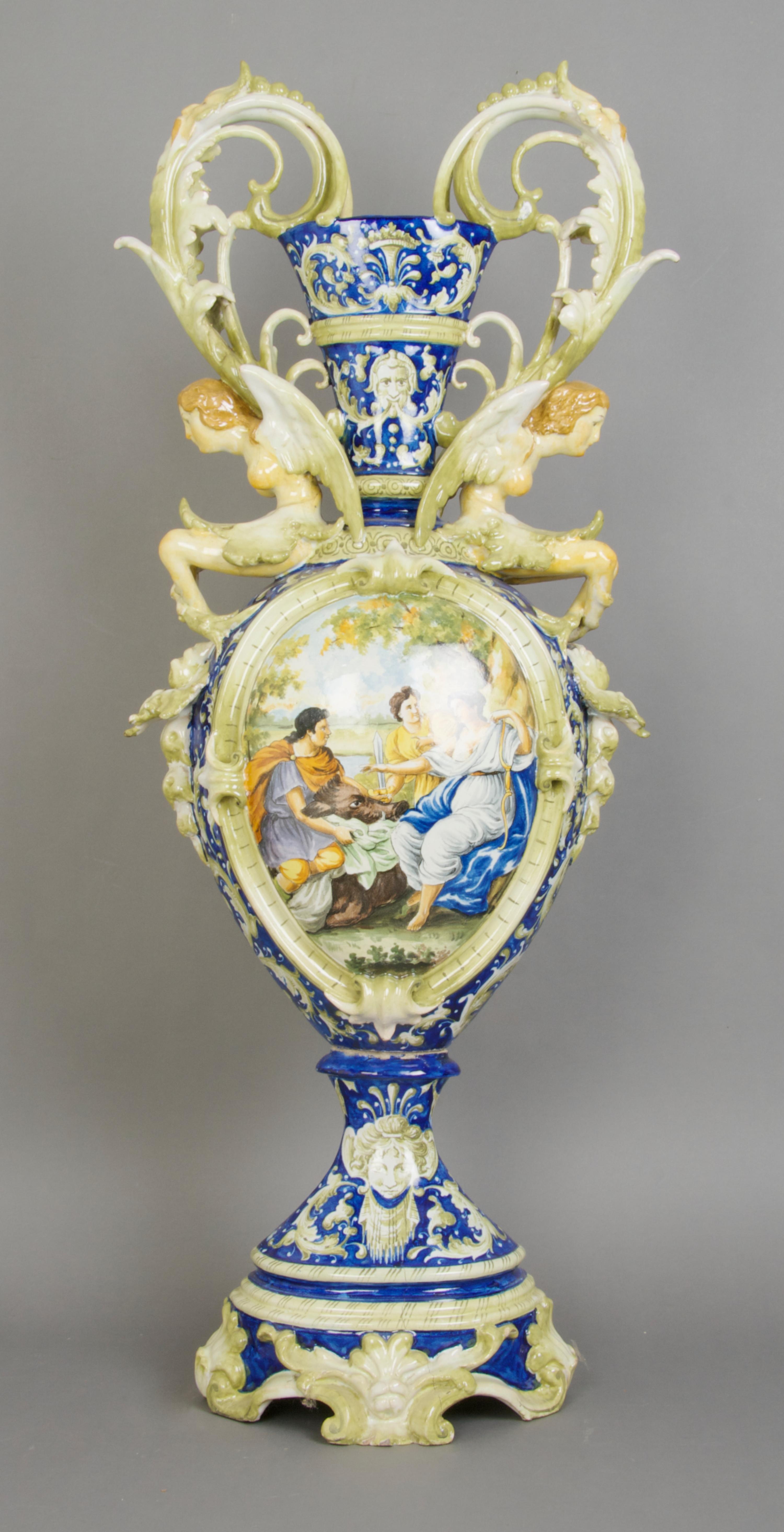 An Italian Majolica Handled Urn, Height 34 inches.