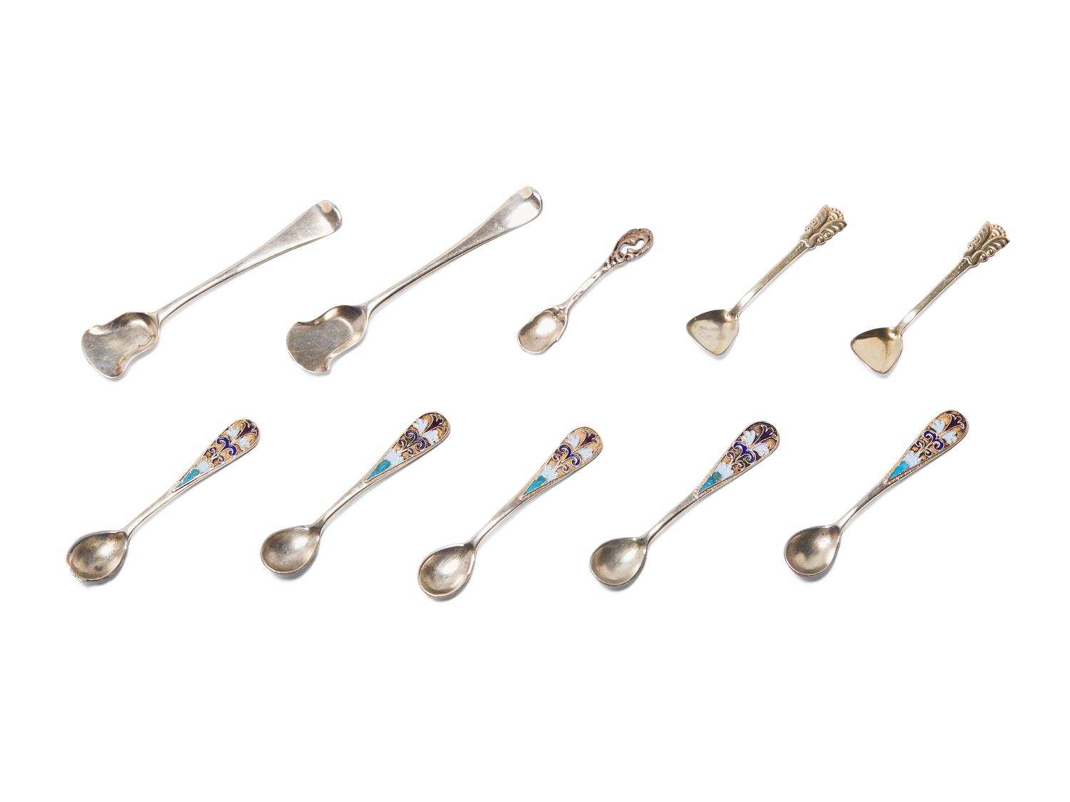 An Assembled Set of Seven Silver and Enameled Salt Cellars with Spoons