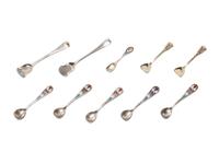 An Assembled Set of Seven Silver and Enameled Salt Cellars with Spoons