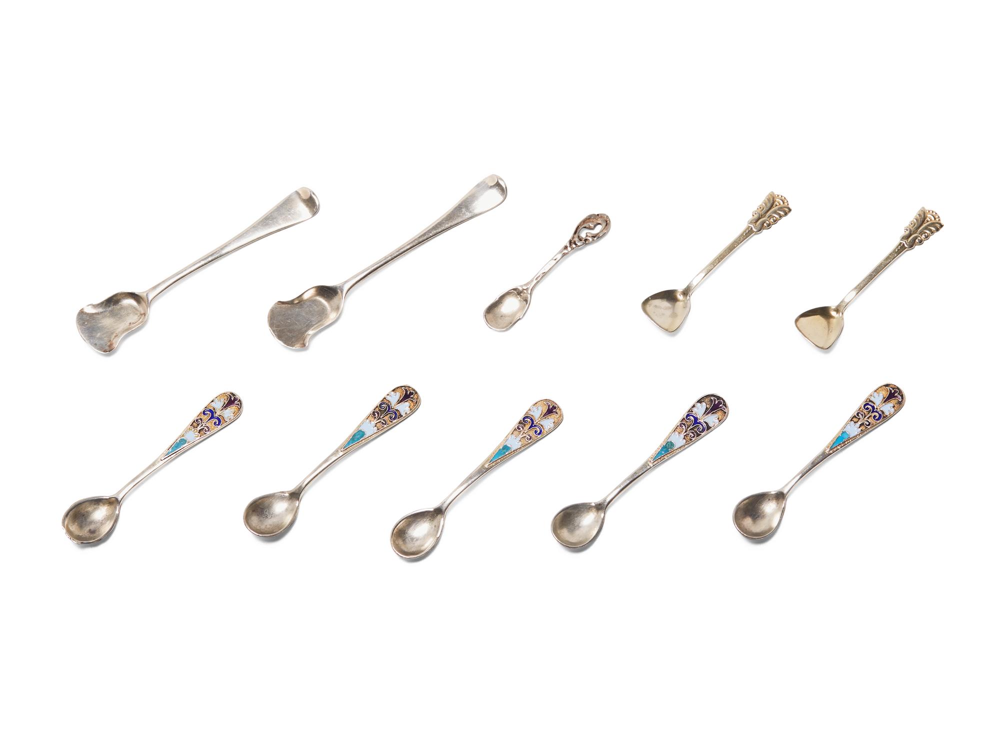 An Assembled Set of Seven Silver and Enameled Salt Cellars with Spoons