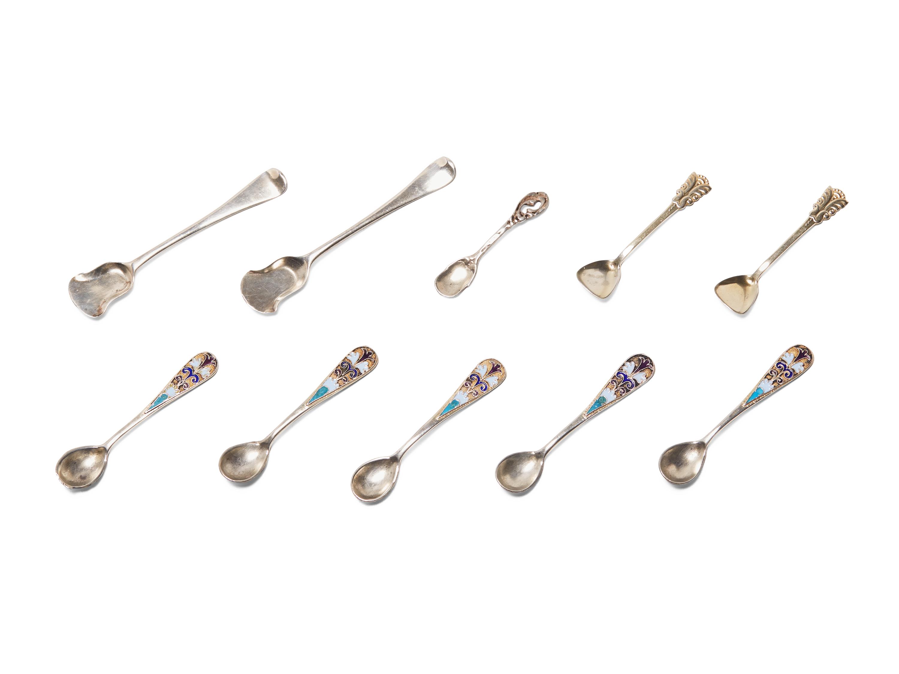 An Assembled Set of Seven Silver and Enameled Salt Cellars with Spoons