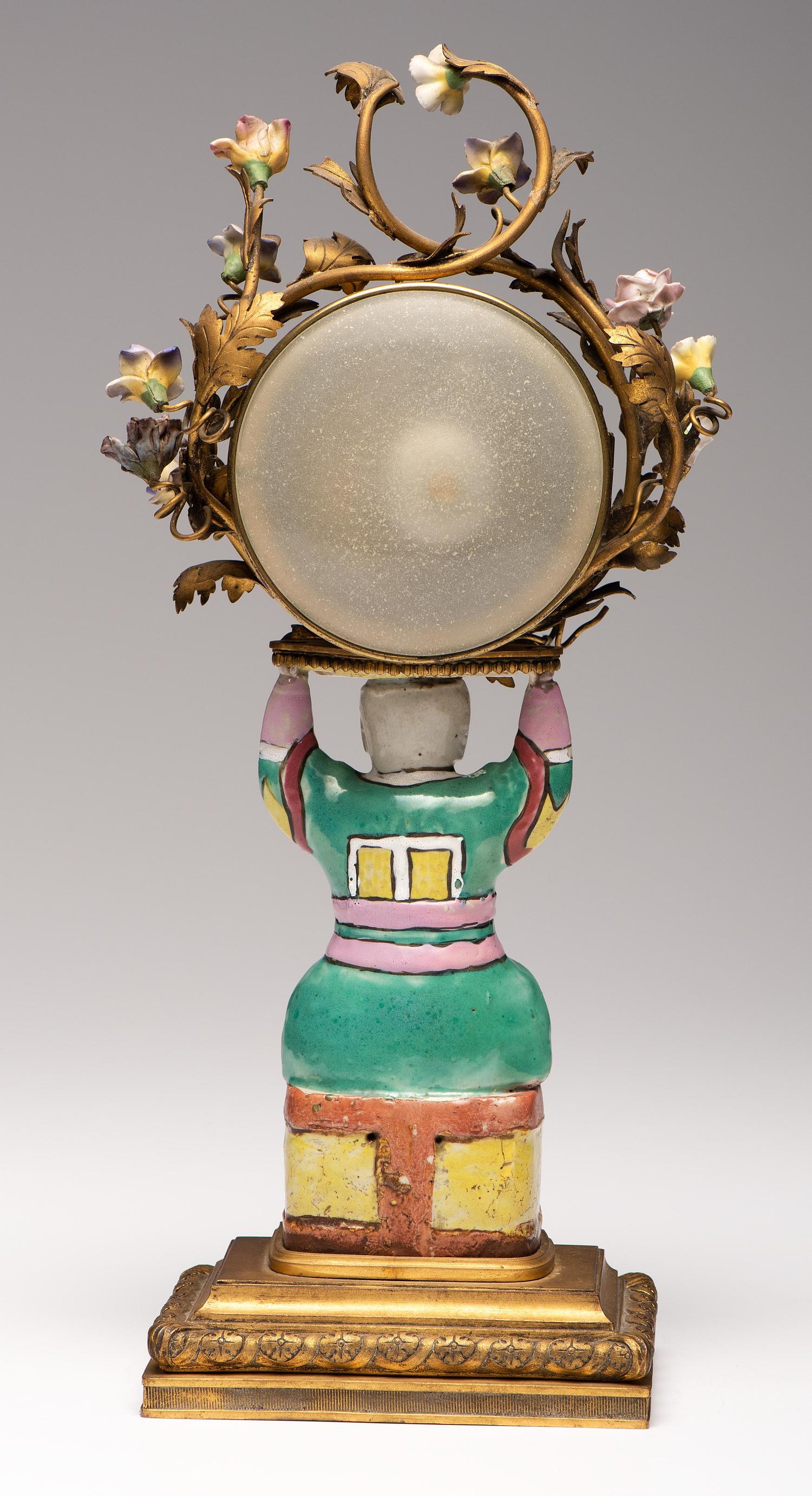 A French Gilt Bronze and Porcelain Mantel Clock