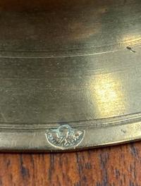 A Rare Continental Brass Bell-Bottom Candlestick