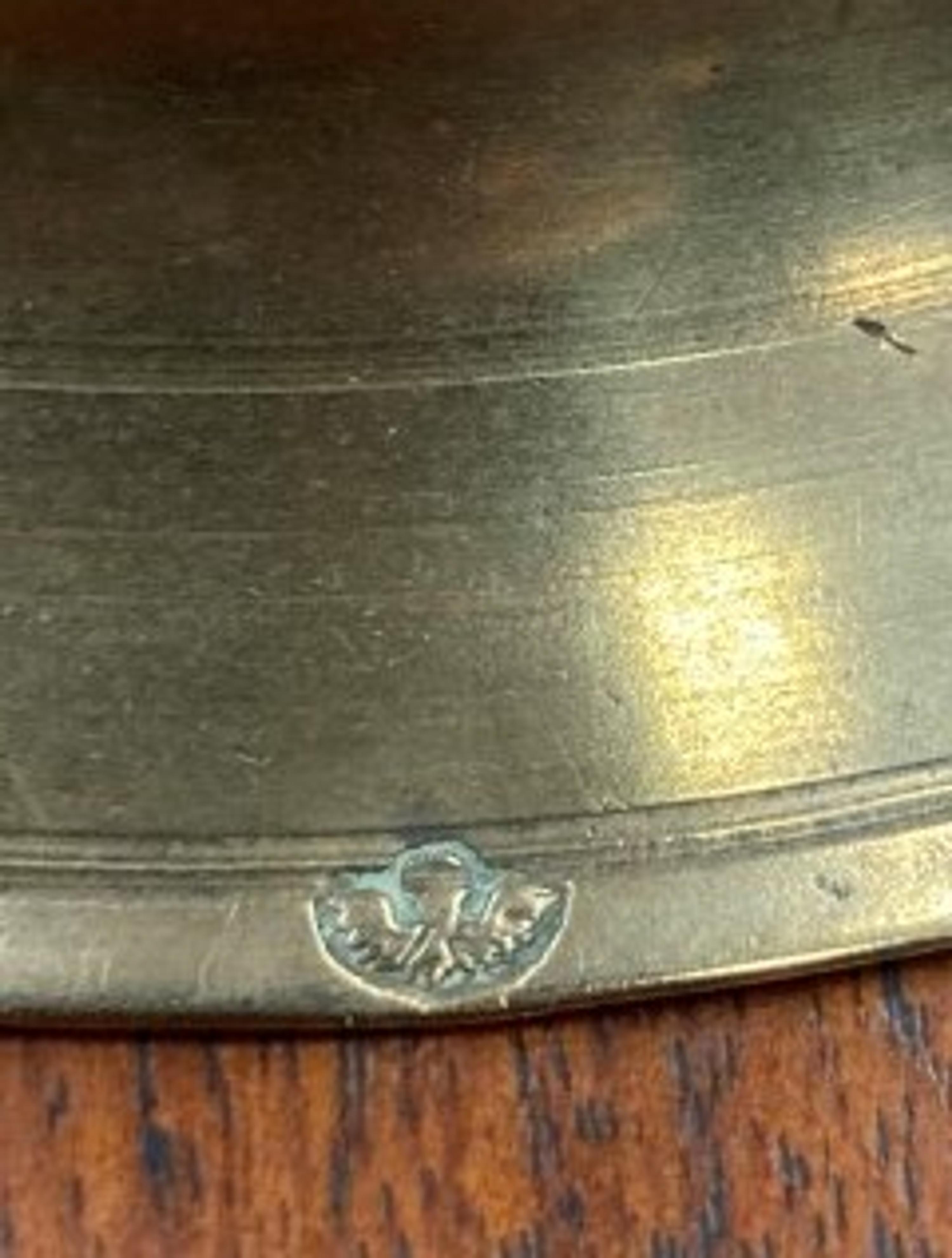 A Rare Continental Brass Bell-Bottom Candlestick