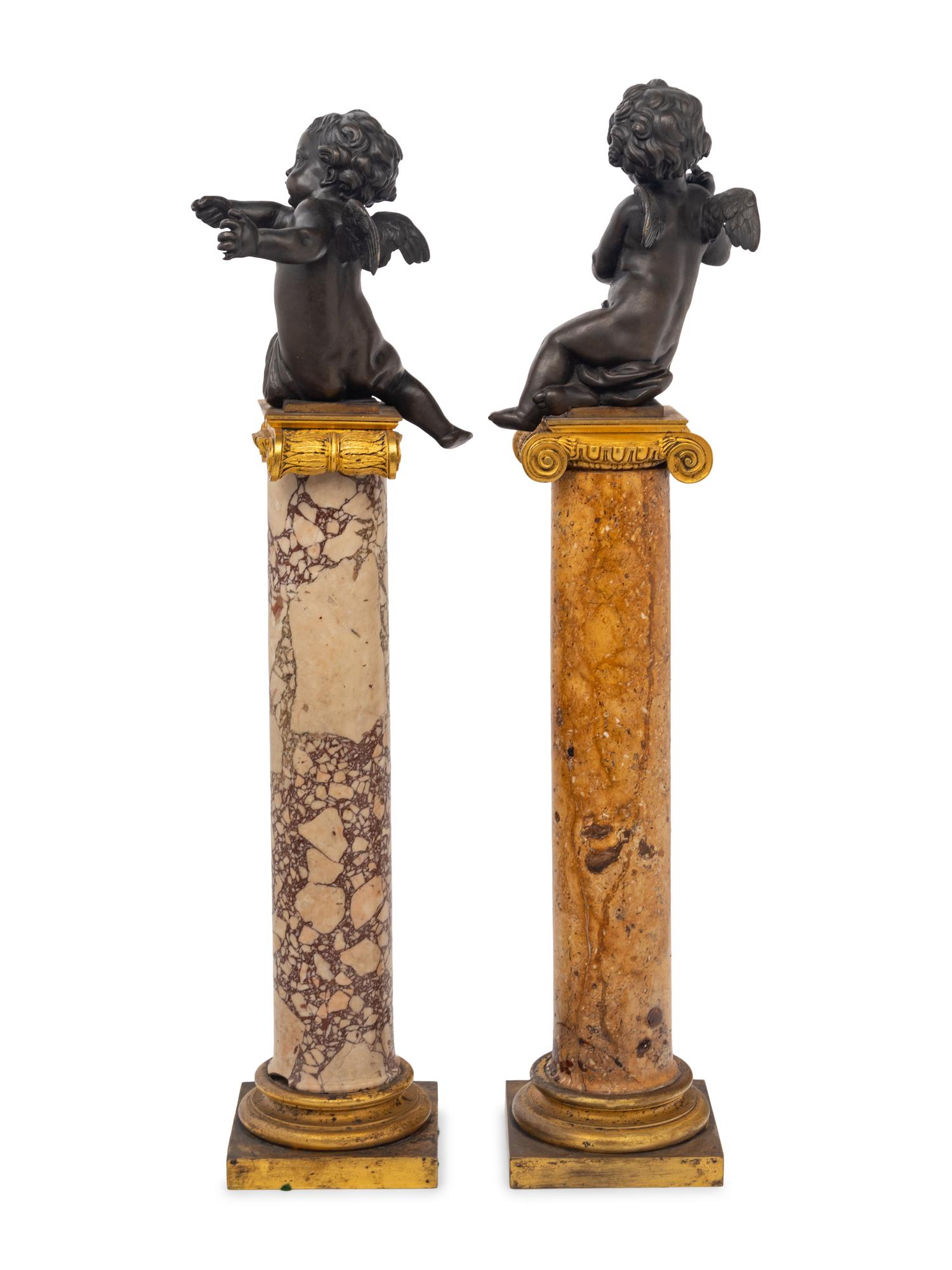 A Near Pair of French Bronze Putti on Gilt Bronze Mounted Marble Columns