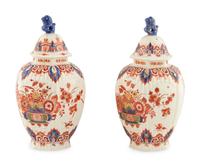 A Pair Of Delft Covered Jars