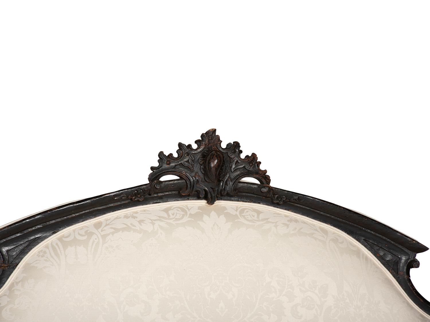 An Italian Carved and Black Painted Walnut High-Back Sofa