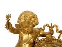 A Louis XVI Style Gilt Bronze and White Marble Mantel Clock