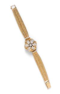 A 14 Karat Yellow Gold and Diamond Articulated Surprise Watch, Mathey Tissot, 24.80 dwts.