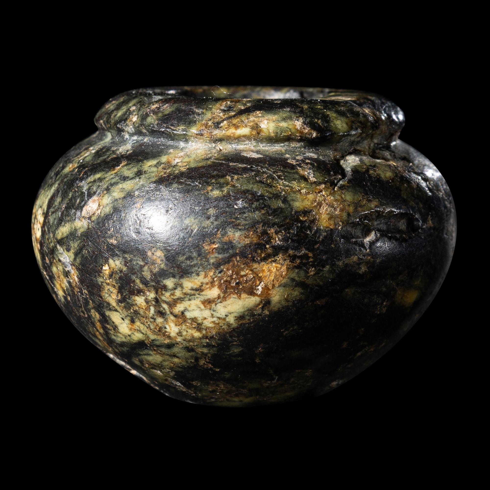 An Egyptian Serpentine Cosmetic Vessel