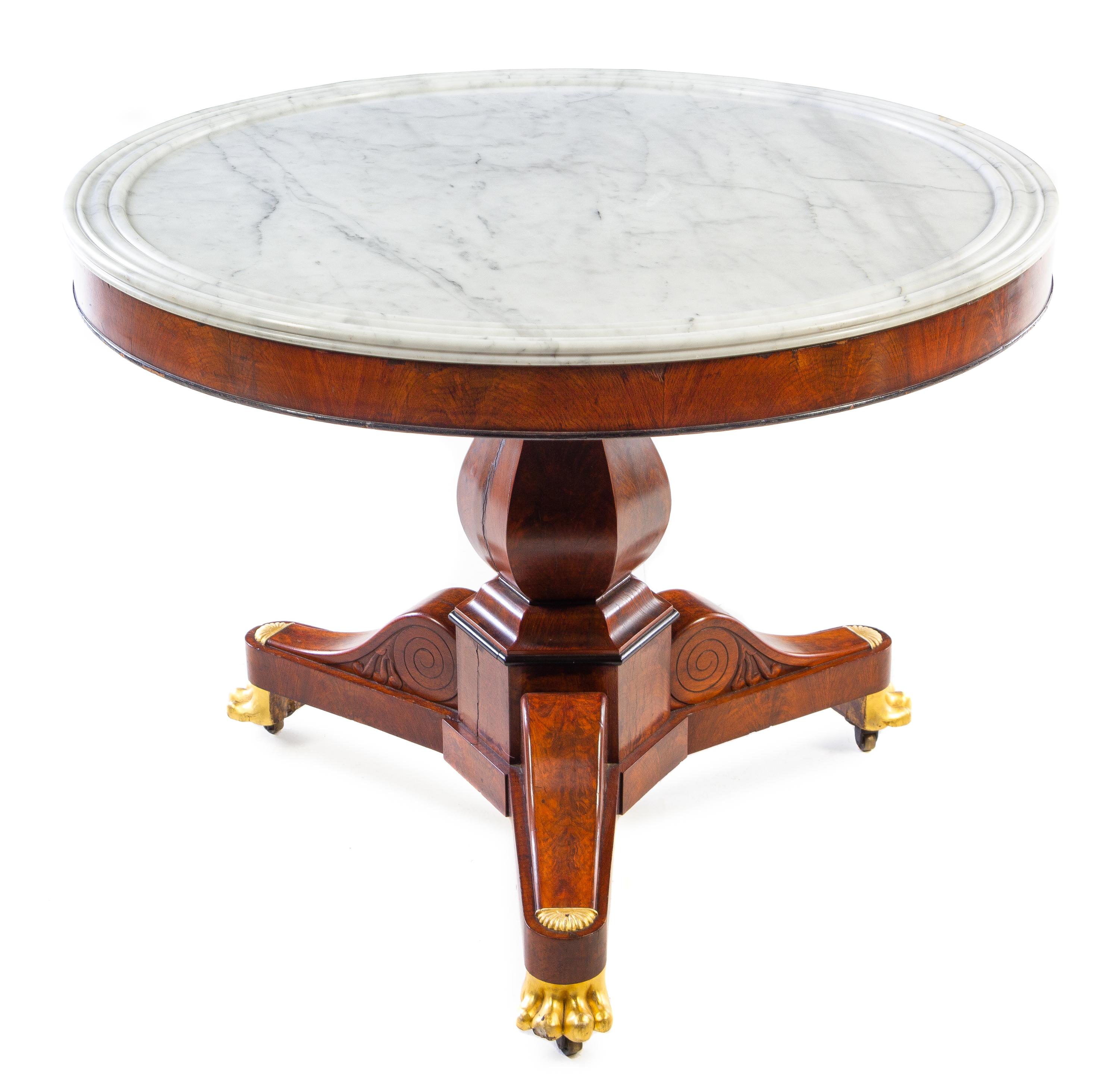 An Empire Style Parcel Gilt Burl Walnut Center Table Height 29 x diameter of top 39 inches. — 19TH CENTURY