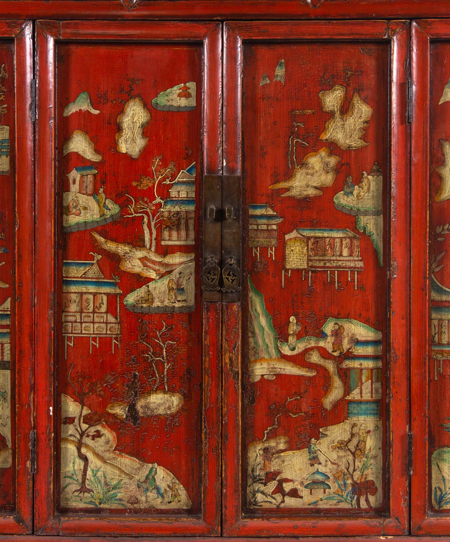 A Chinese Red Lacquered and Chinoiserie Decorated Armoire