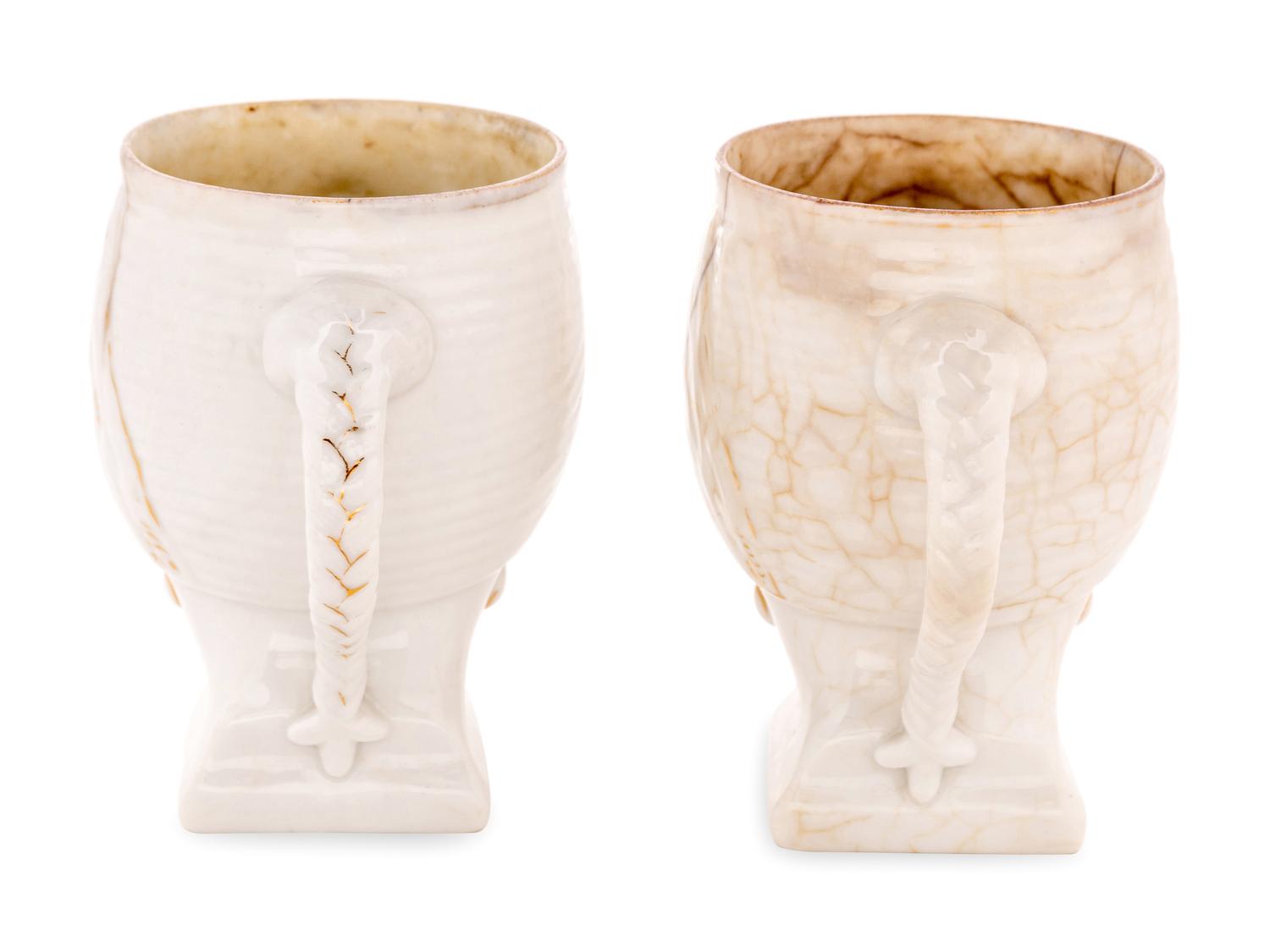 A Pair of Khrapunov-Novykh Porcelain Figural Mugs