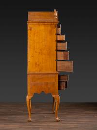 A Queen Anne Fan-Carved Tiger Maple Bonnet-Top Tablet-Foot High Chest