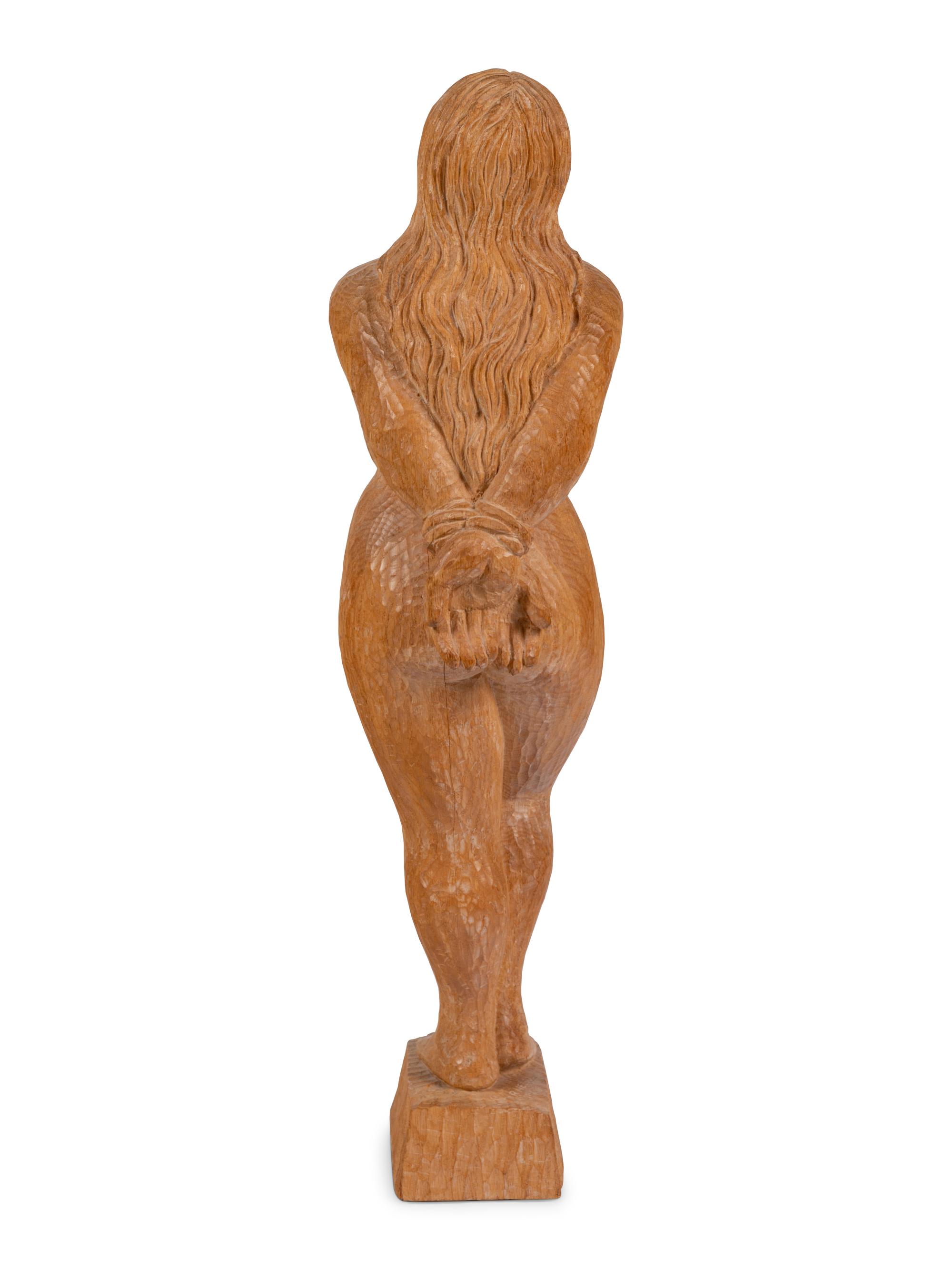 A Carved Oak Figure of a Bound Woman
