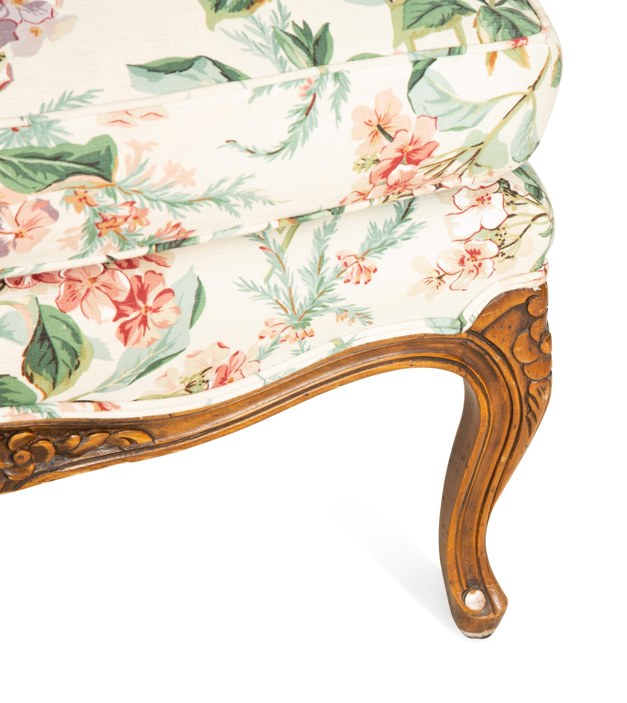 A Pair of Louis XV Style Walnut Bergères
