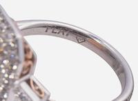 A Platinum, Rose Gold, Pink Diamond, and Diamond Ring