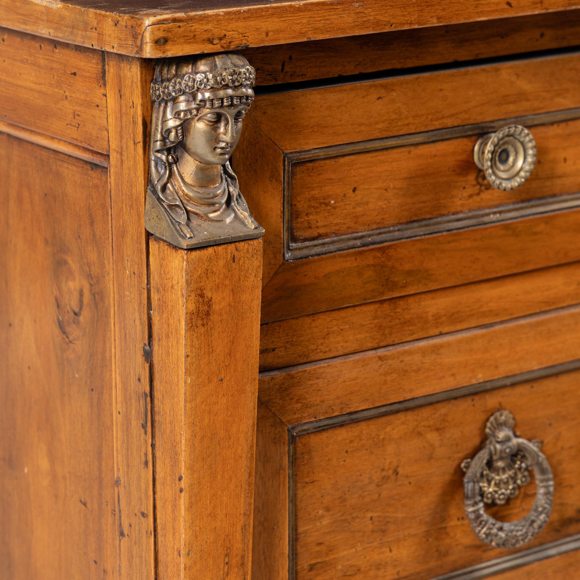 An Italian Neoclassical Gilt Metal Mounted Walnut Chest of Drawers