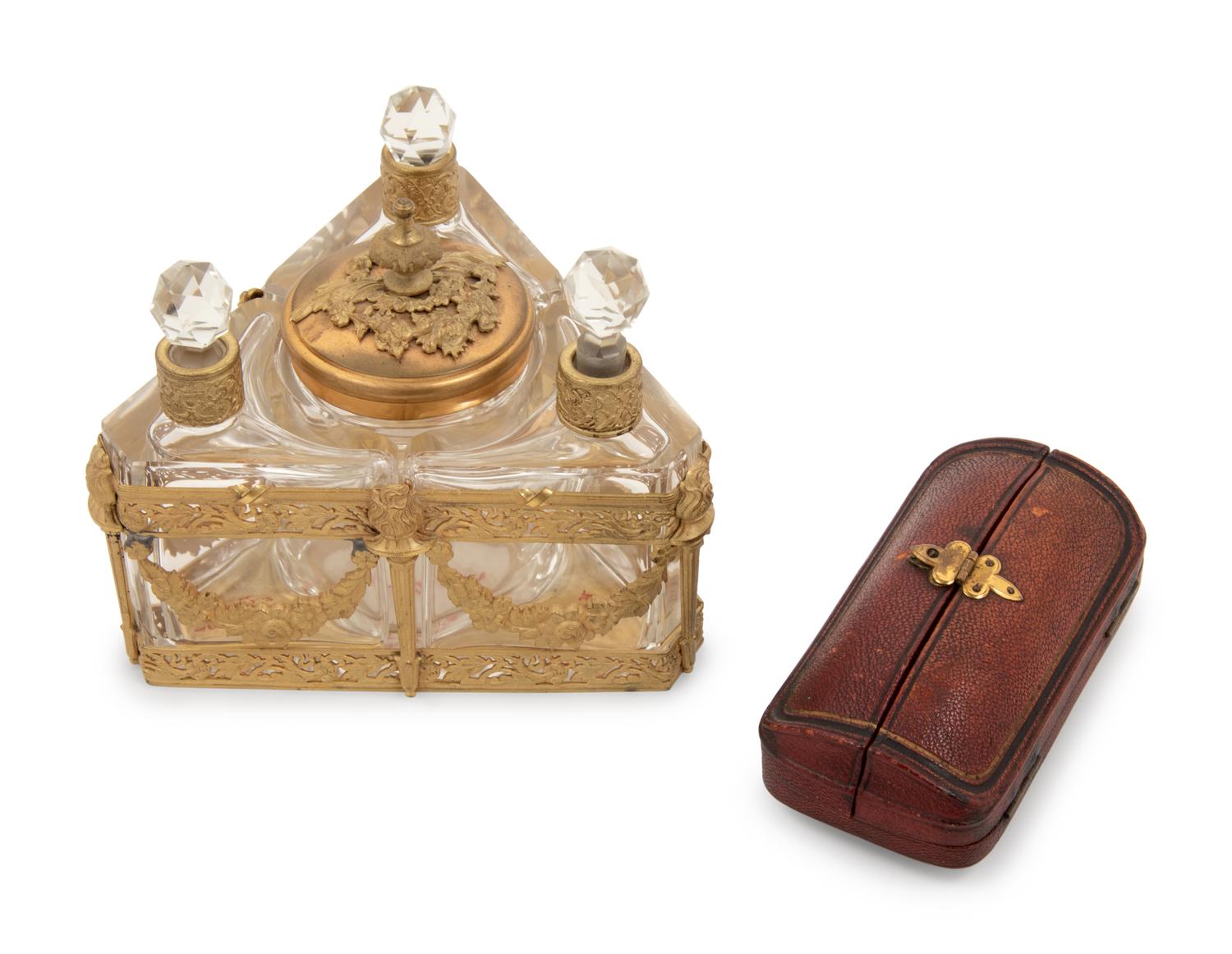 A Group of Metal-Mounted Glass Scent Bottles