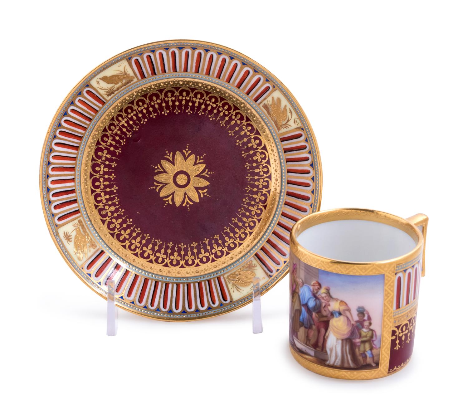 A Vienna Painted and Parcel Gilt Porcelain Teacup and Saucer