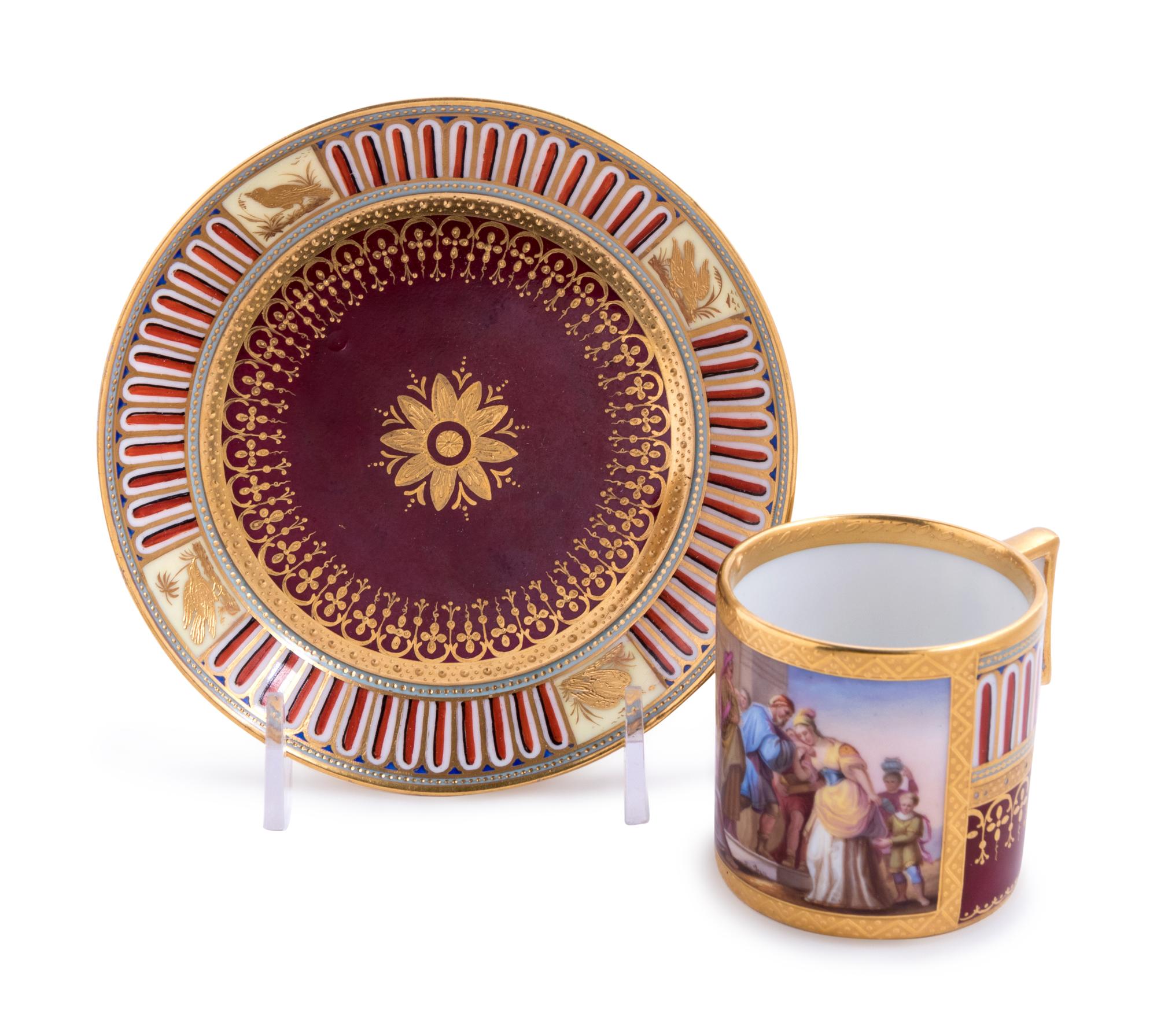 A Vienna Painted and Parcel Gilt Porcelain Teacup and Saucer