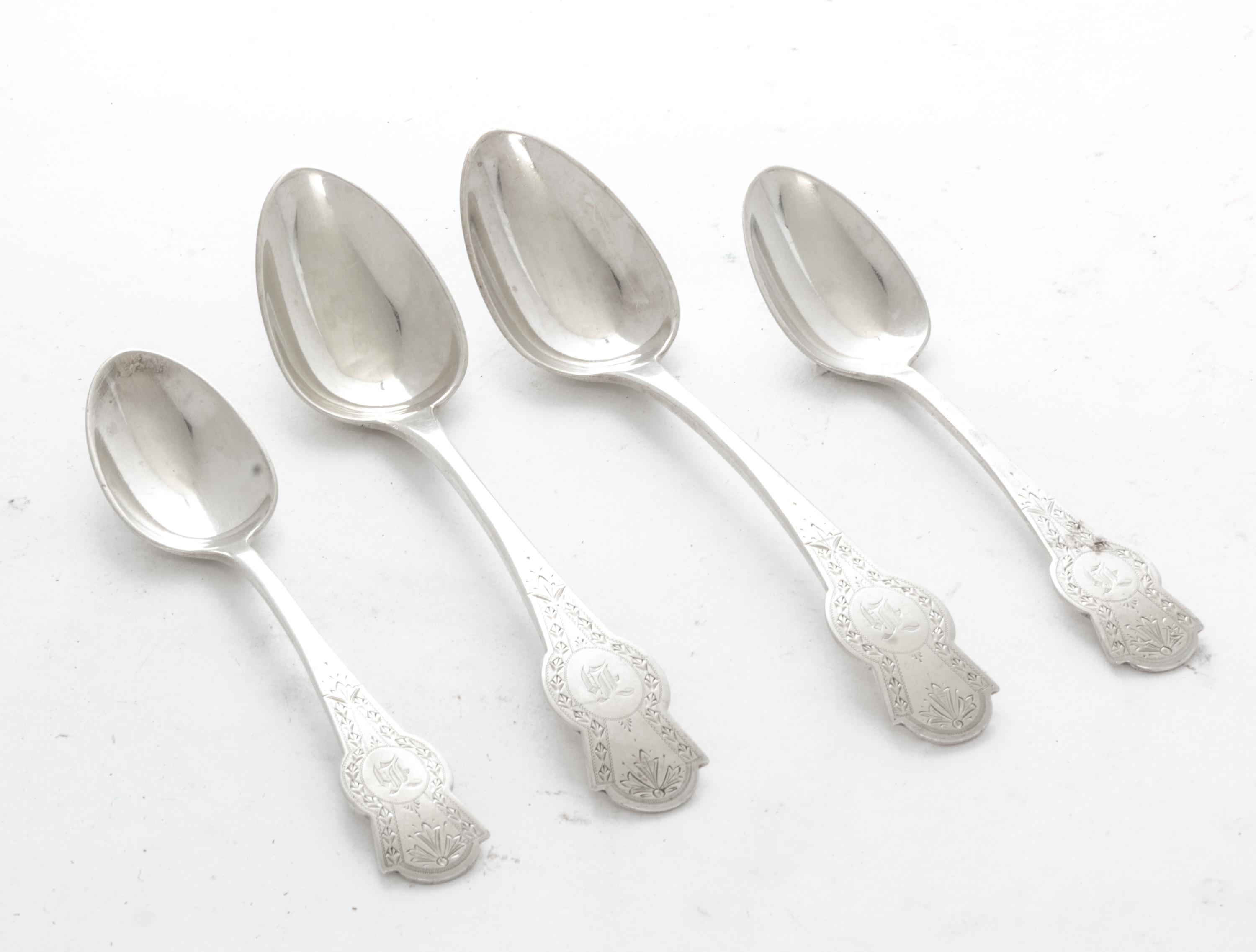 A Collection of American Coin Silver Spoons, N. Harding & Co., Boston, MA, comprising 11 teaspoons and 11 soup spoons, each decorated w