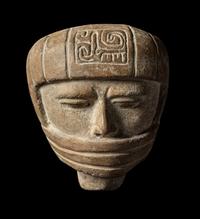 A Veracruz Terracotta Head Wearing a Helmet with an Incised Glyph