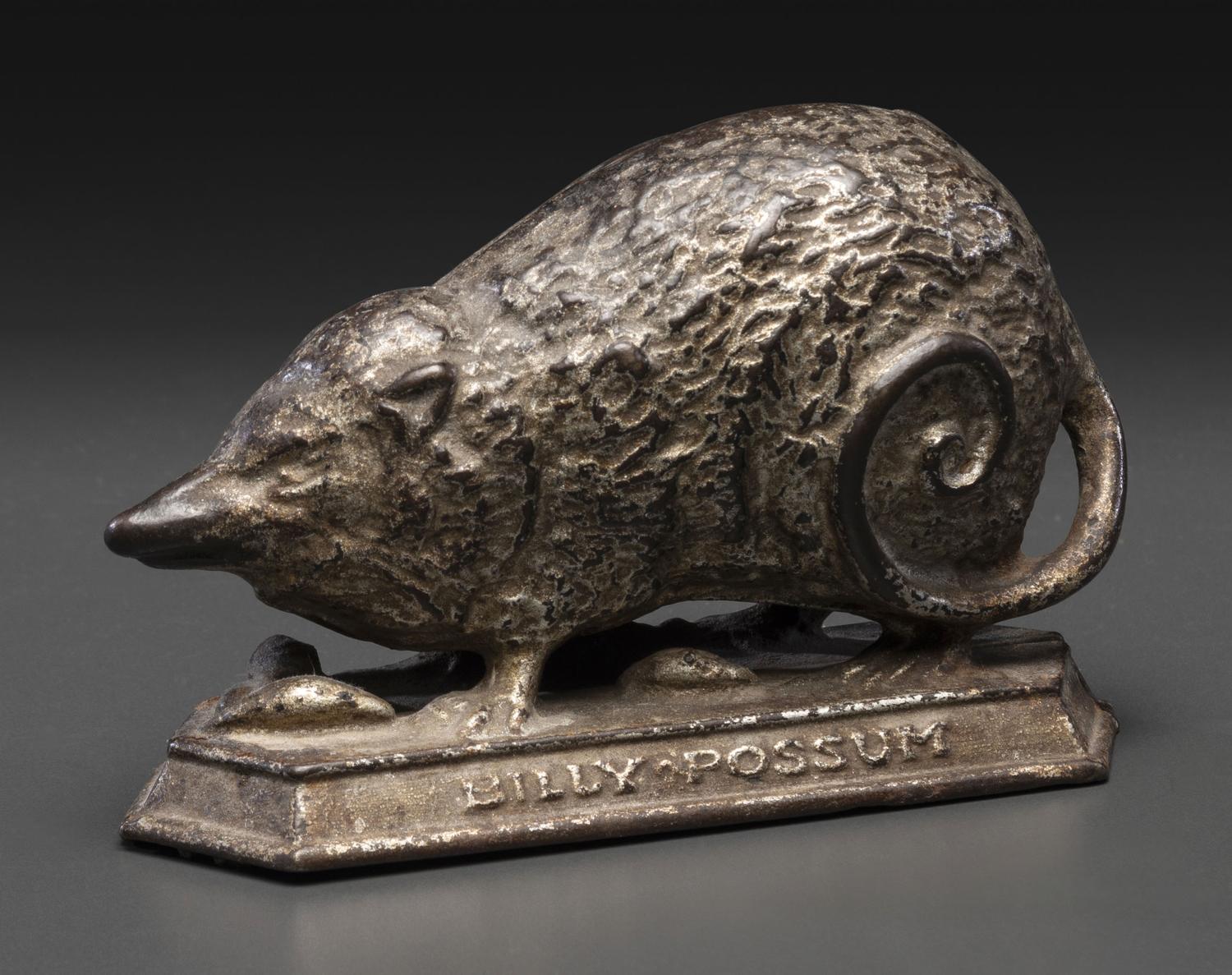 A 'Billy Possum' Cast Iron Still Bank