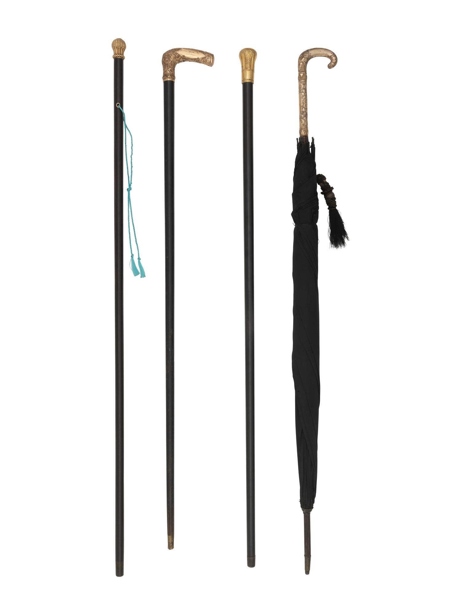 Four Gold Plated Handled Walking Sticks