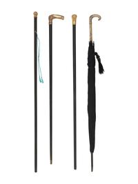 Four Gold Plated Handled Walking Sticks