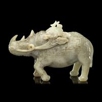 A Chinese Carved Celadon Jade Archaistic Rhinoceros-Form Covered Vessel, 20th Century 近代 青玉仿古犀尊