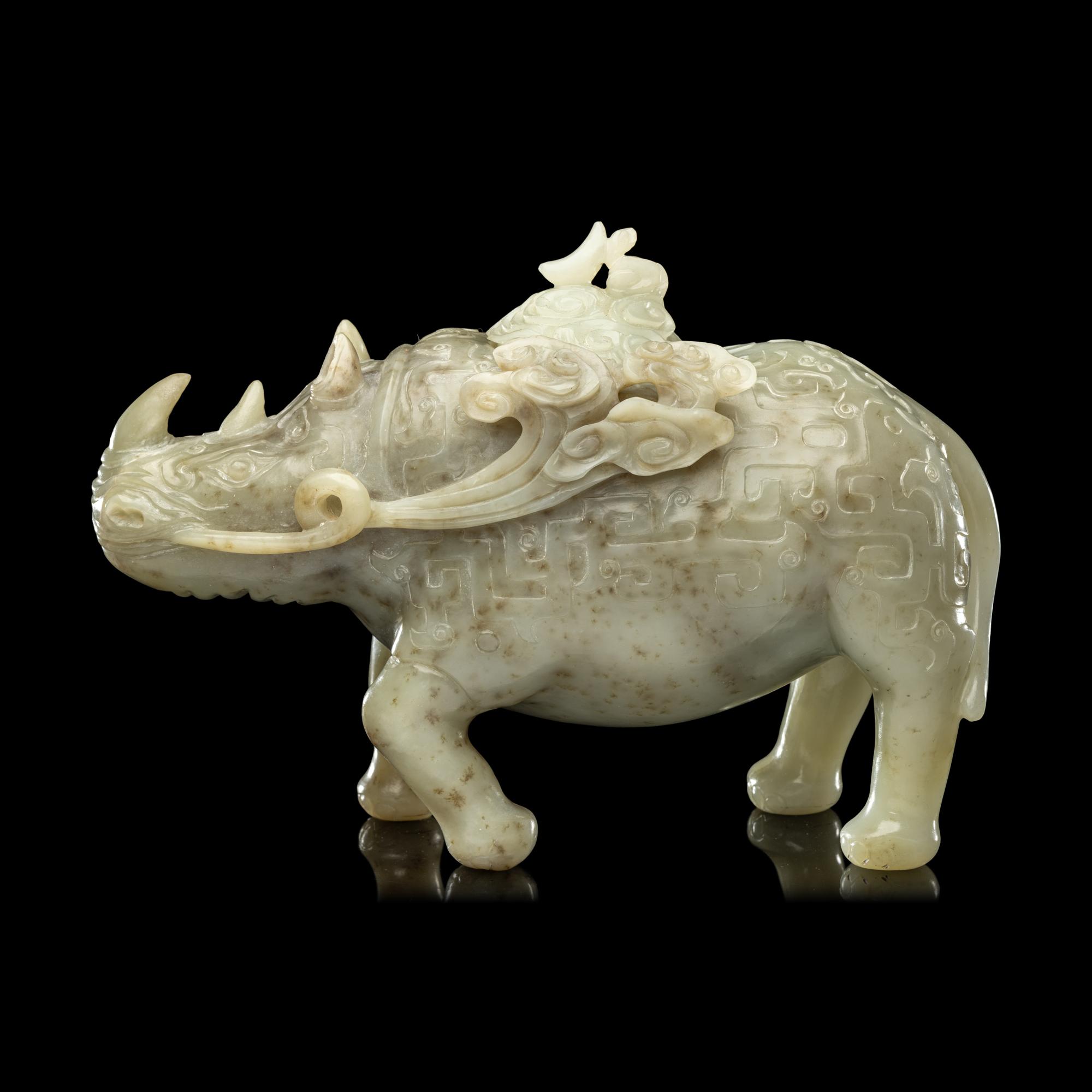 A Chinese Carved Celadon Jade Archaistic Rhinoceros-Form Covered Vessel, 20th Century 近代 青玉仿古犀尊