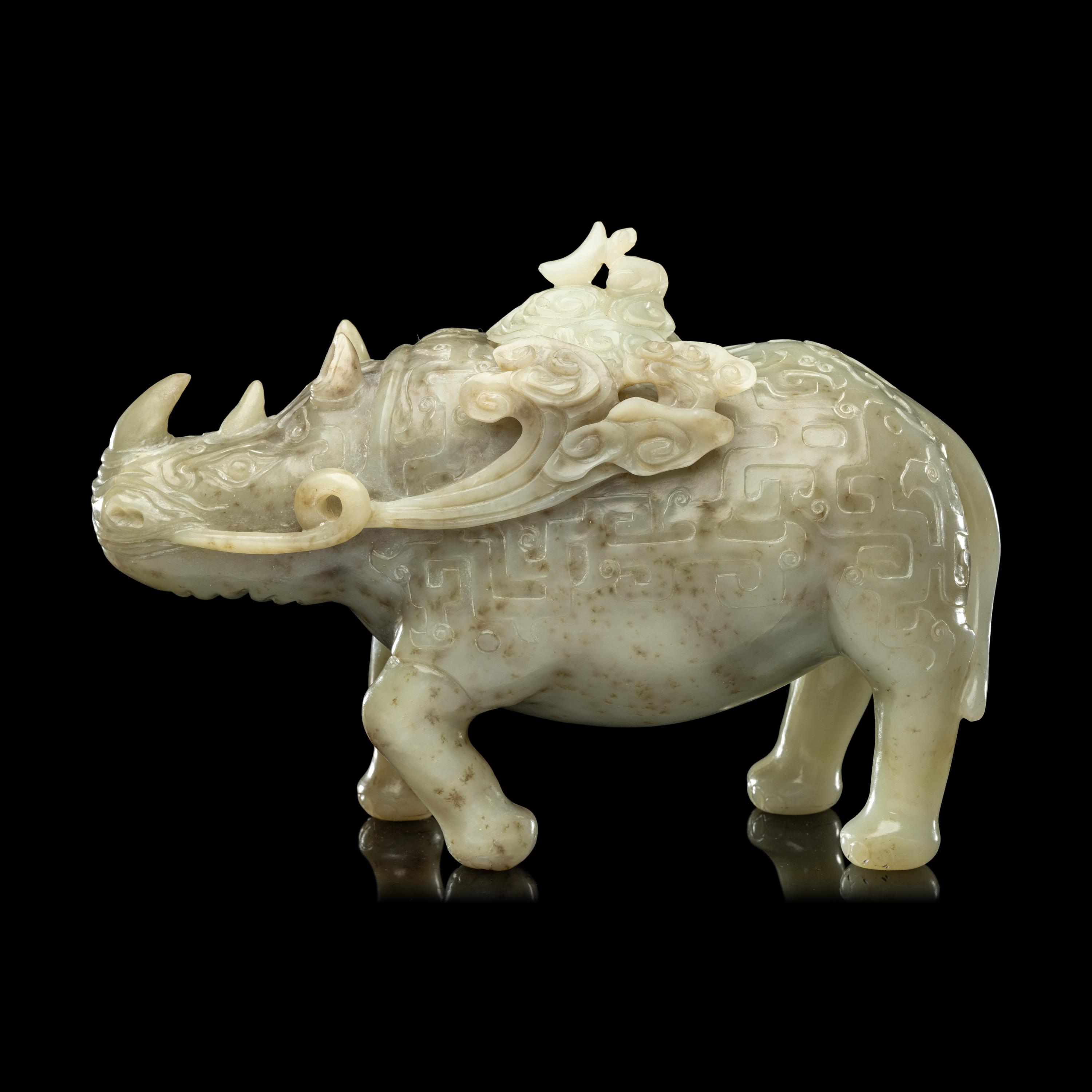 A Chinese Carved Celadon Jade Archaistic Rhinoceros-Form Covered Vessel, 20th Century 近代 青玉仿古犀尊