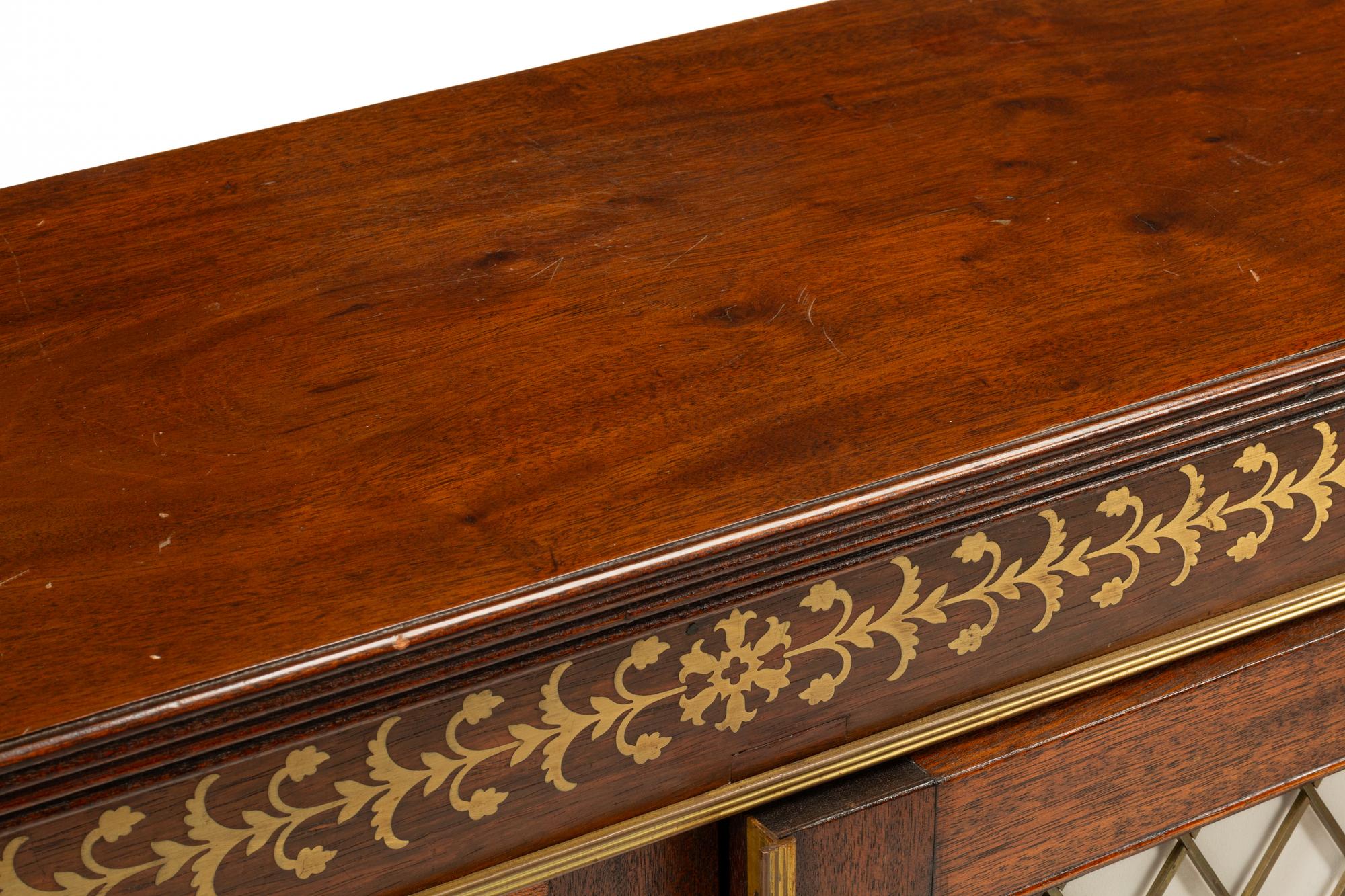 A Pair of Regency Style Brass Inlaid Mahogany Cabinets