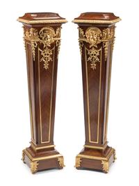 A Pair of Régence Style Gilt Bronze Mounted Bookmatch-Veneered Pedestals